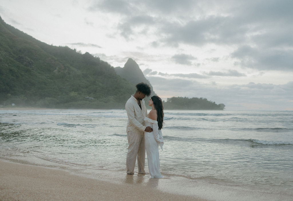 A couple smiling at each other for a Kauai elopement