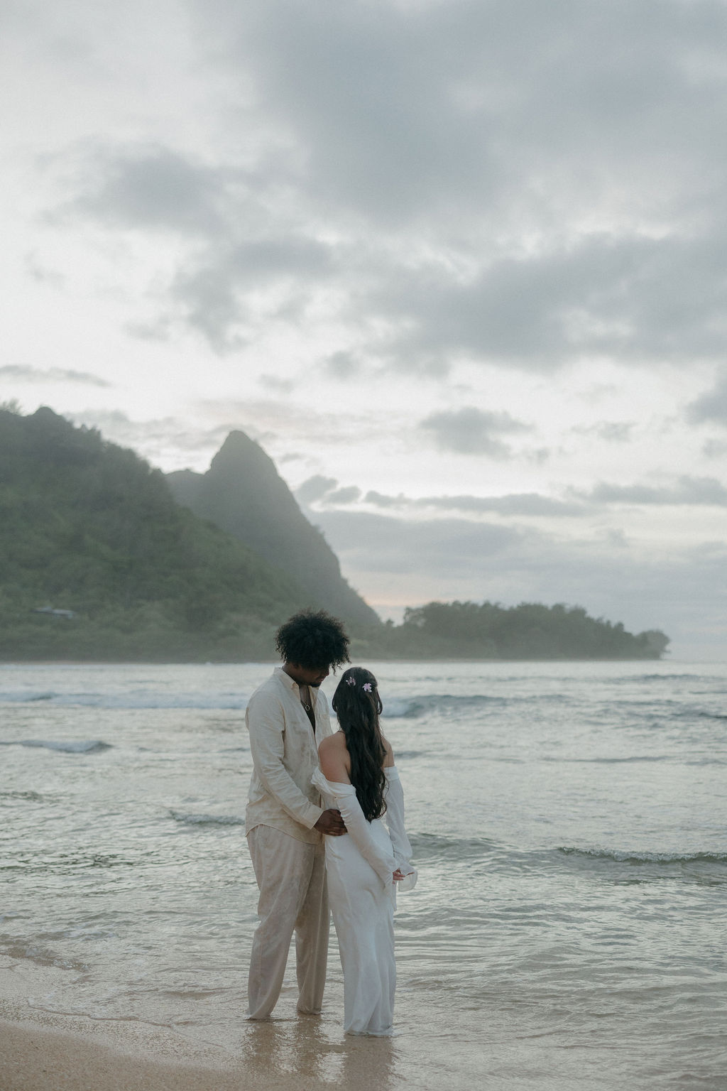 A wedding couple posing for Hawaii elopement photos