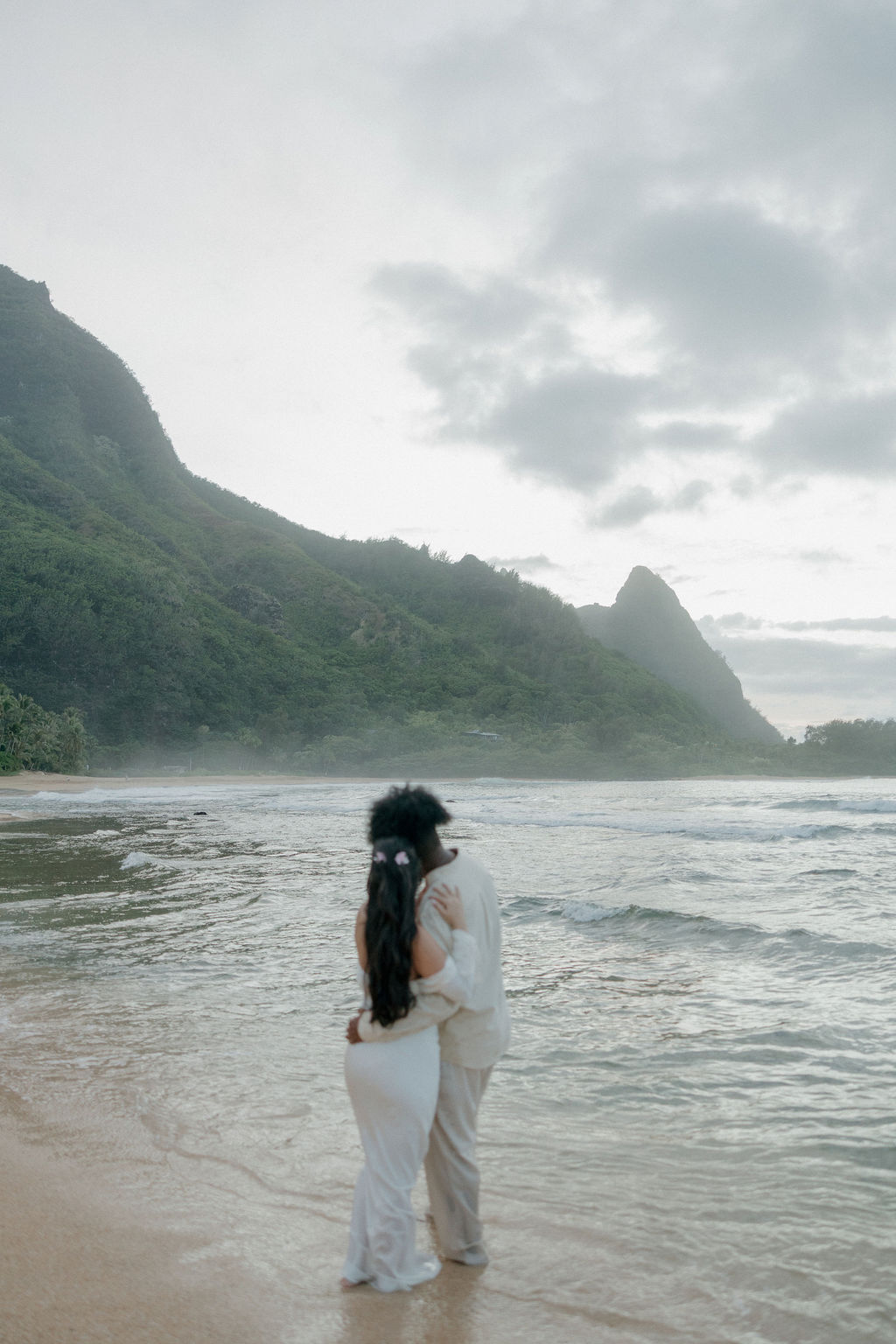 A bride and groom posing for Hawaii elopement photos in Kauai