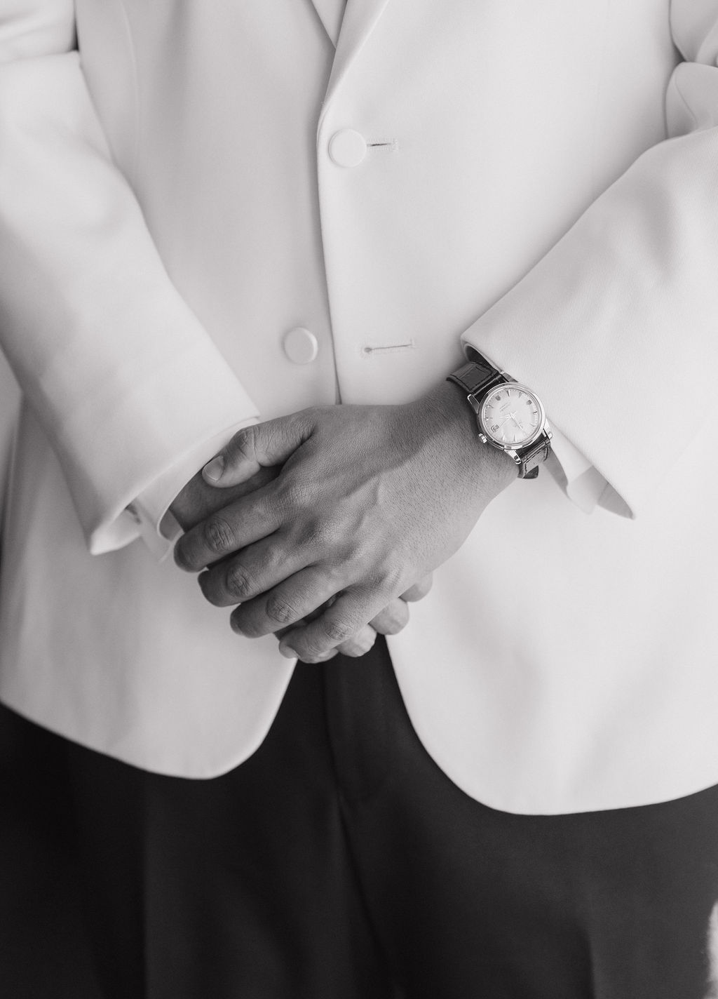 A groom getting ready in his tux