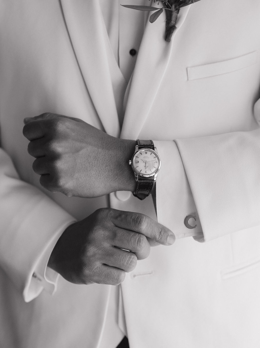 A groom getting ready in his tux