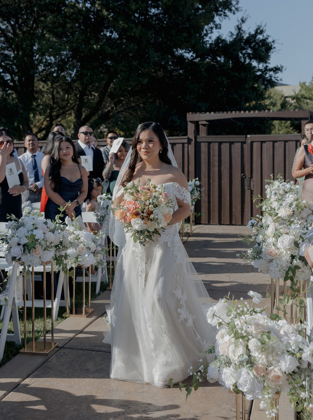 A bride walking down the aisle In a wedding photo captured by a Sacramento wedding photographer from her wedding vendor checklist