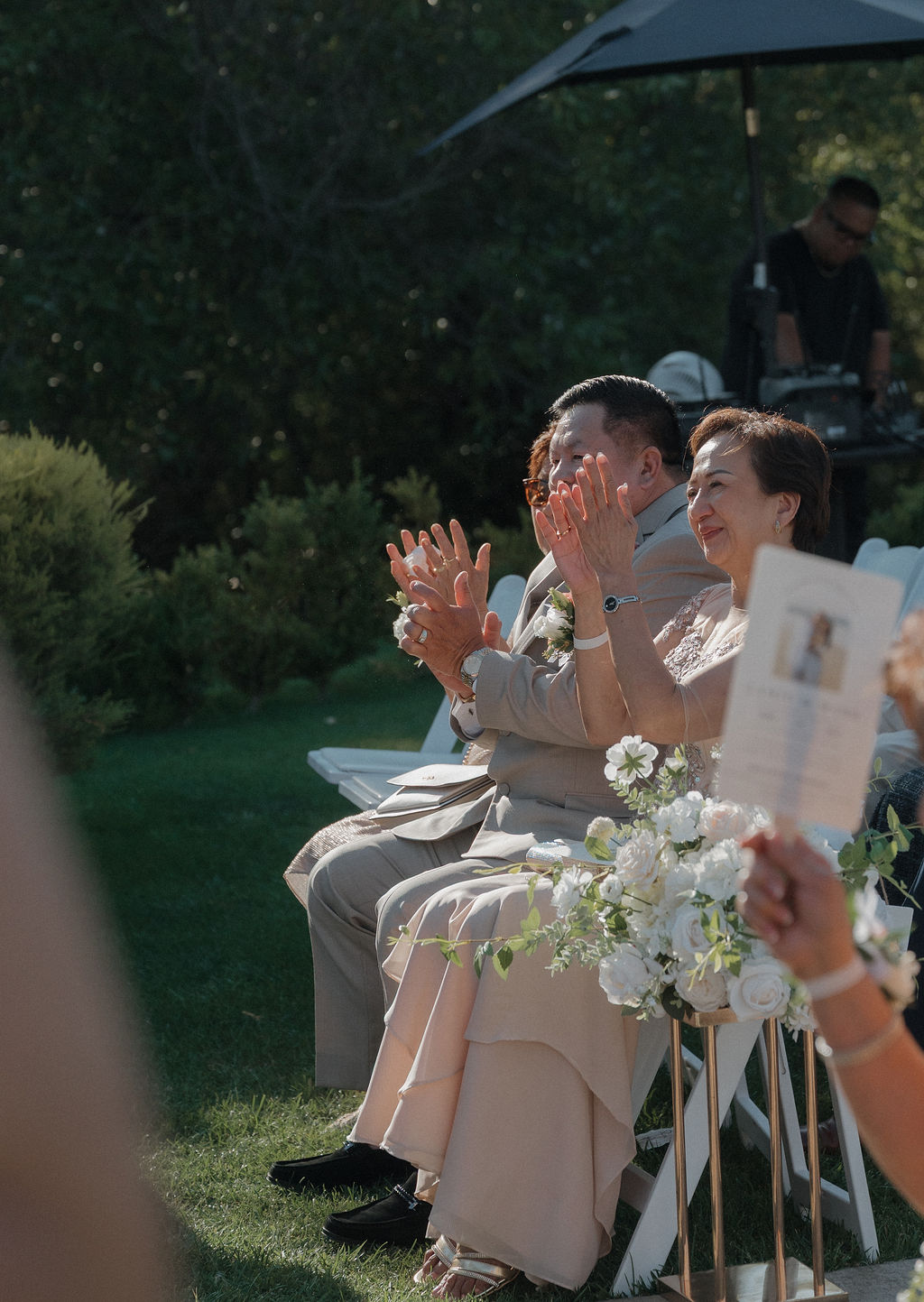 Wedding guests watching a wedding ceremony in a candid photo taken by a Sacramento wedding photographer
