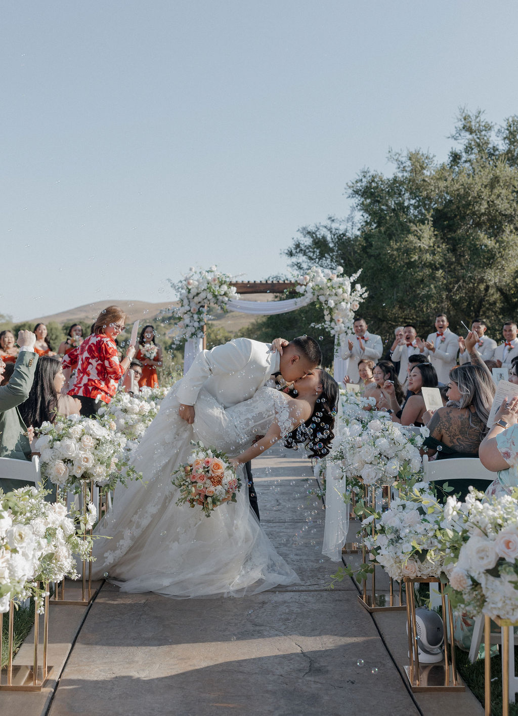 A bride and groom kissing after their wedding reception