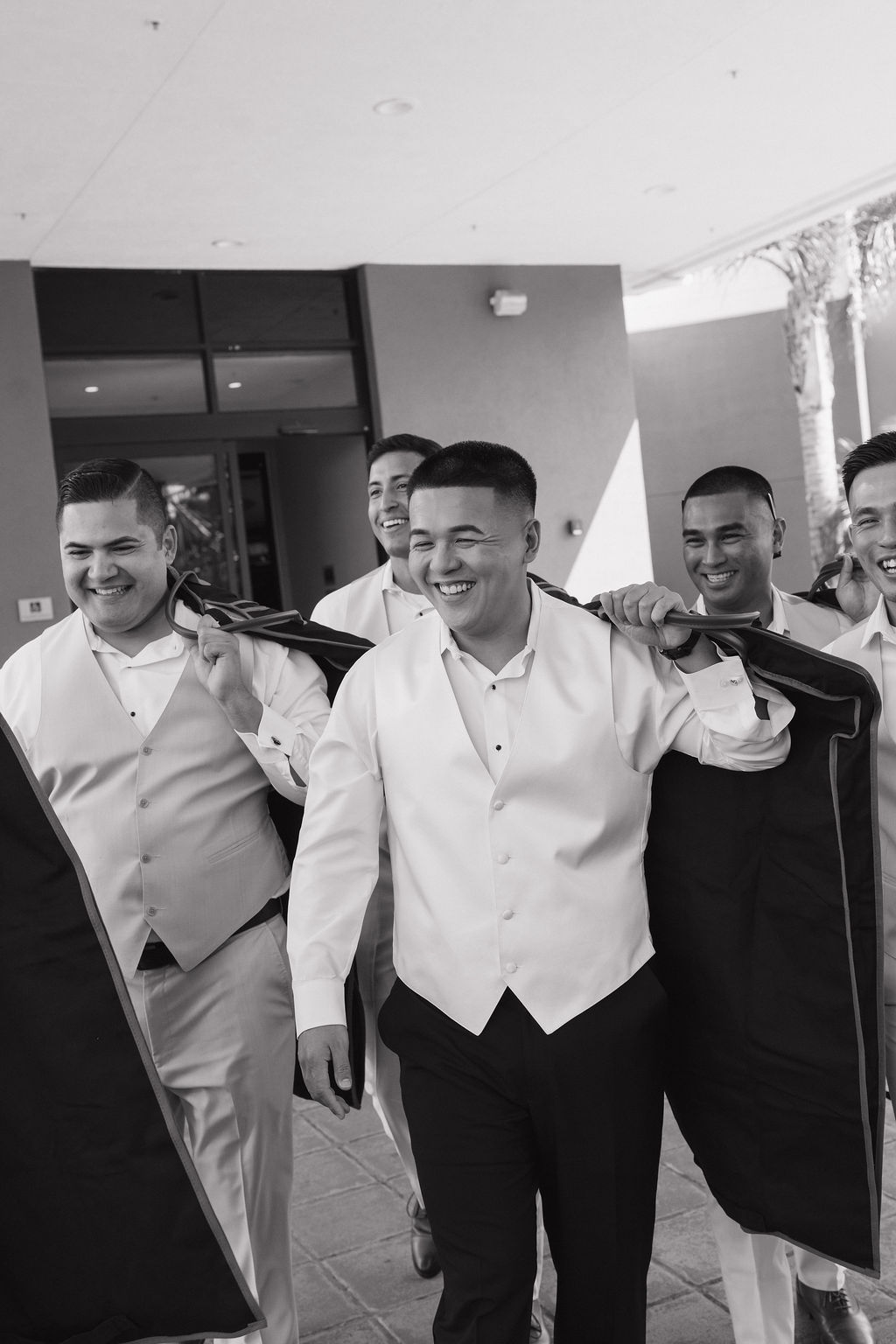 Groomsmen leaving their wedding hotel room