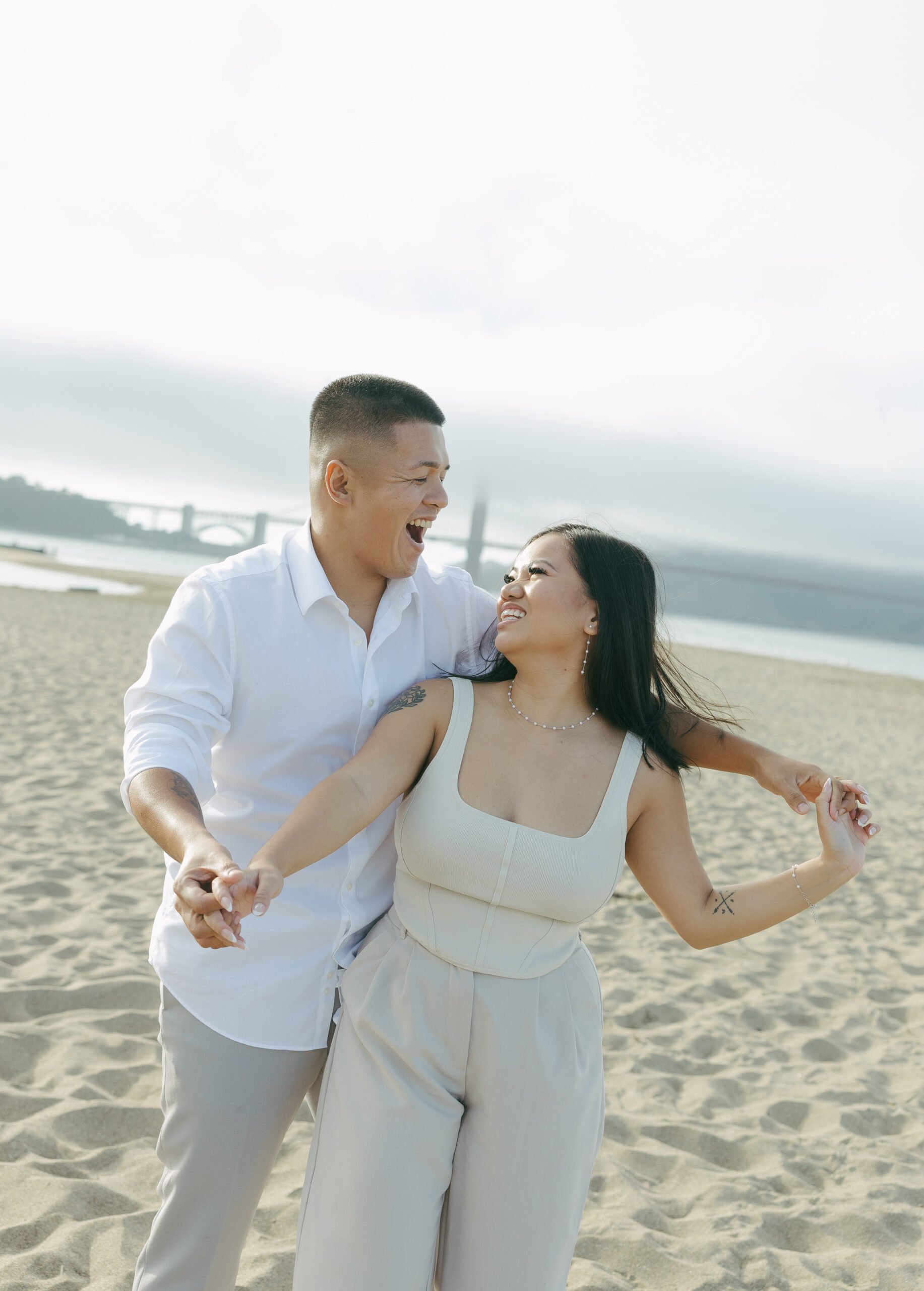 A couple wearing casual engagement photo shoot outfit ideas