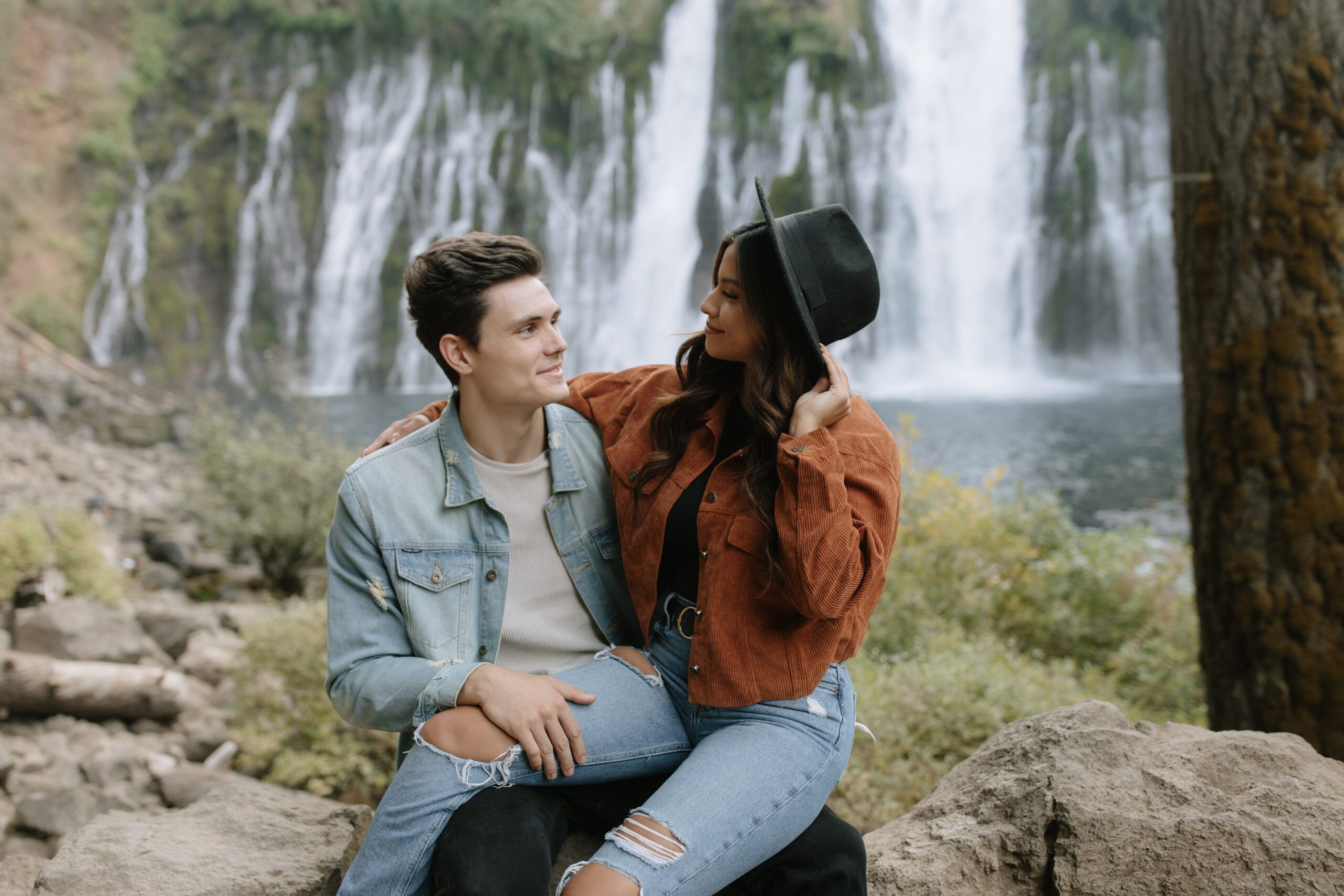 A couple in boho engagement photo shoot outfit ideas