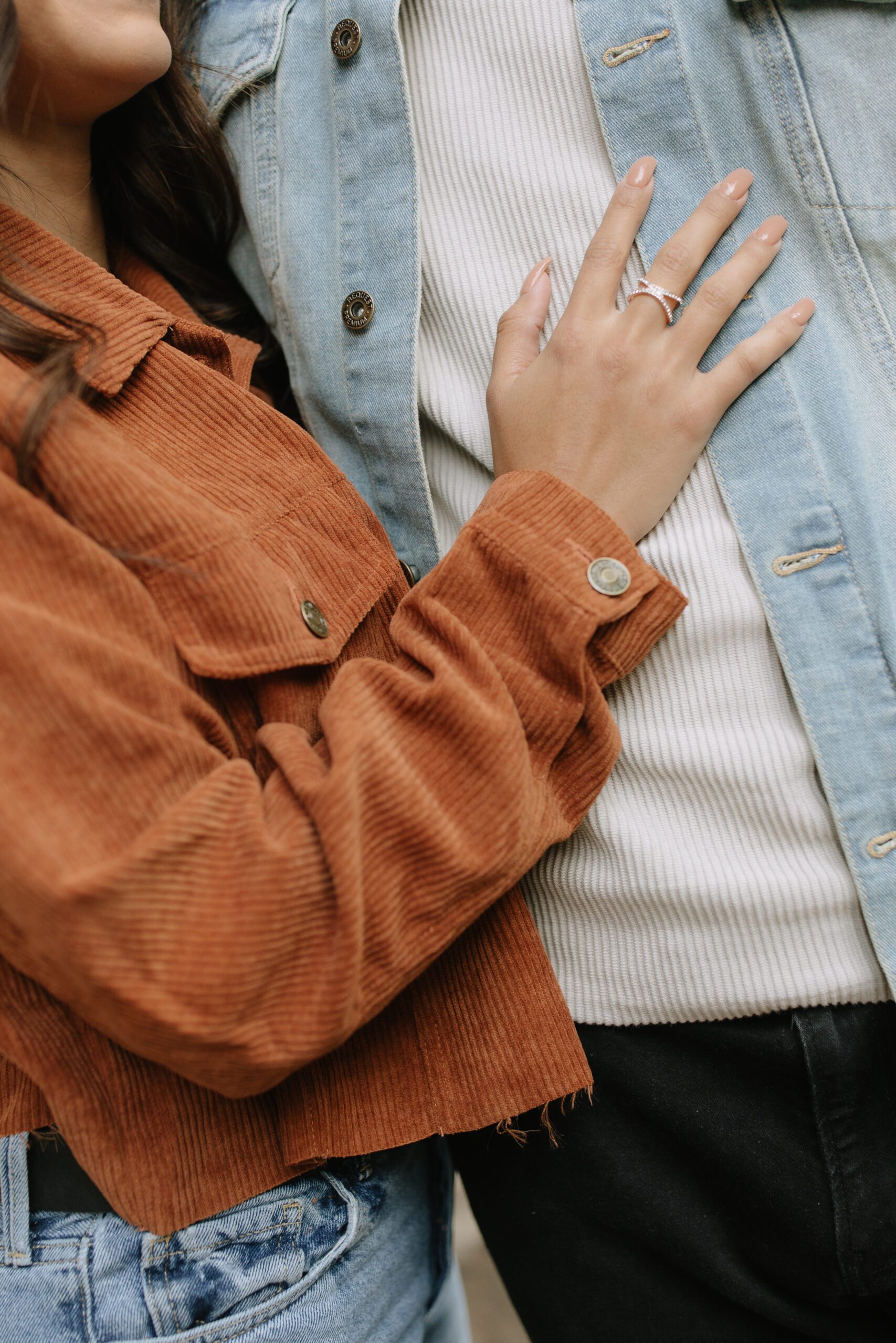 A couple posing for mountain engagement photos