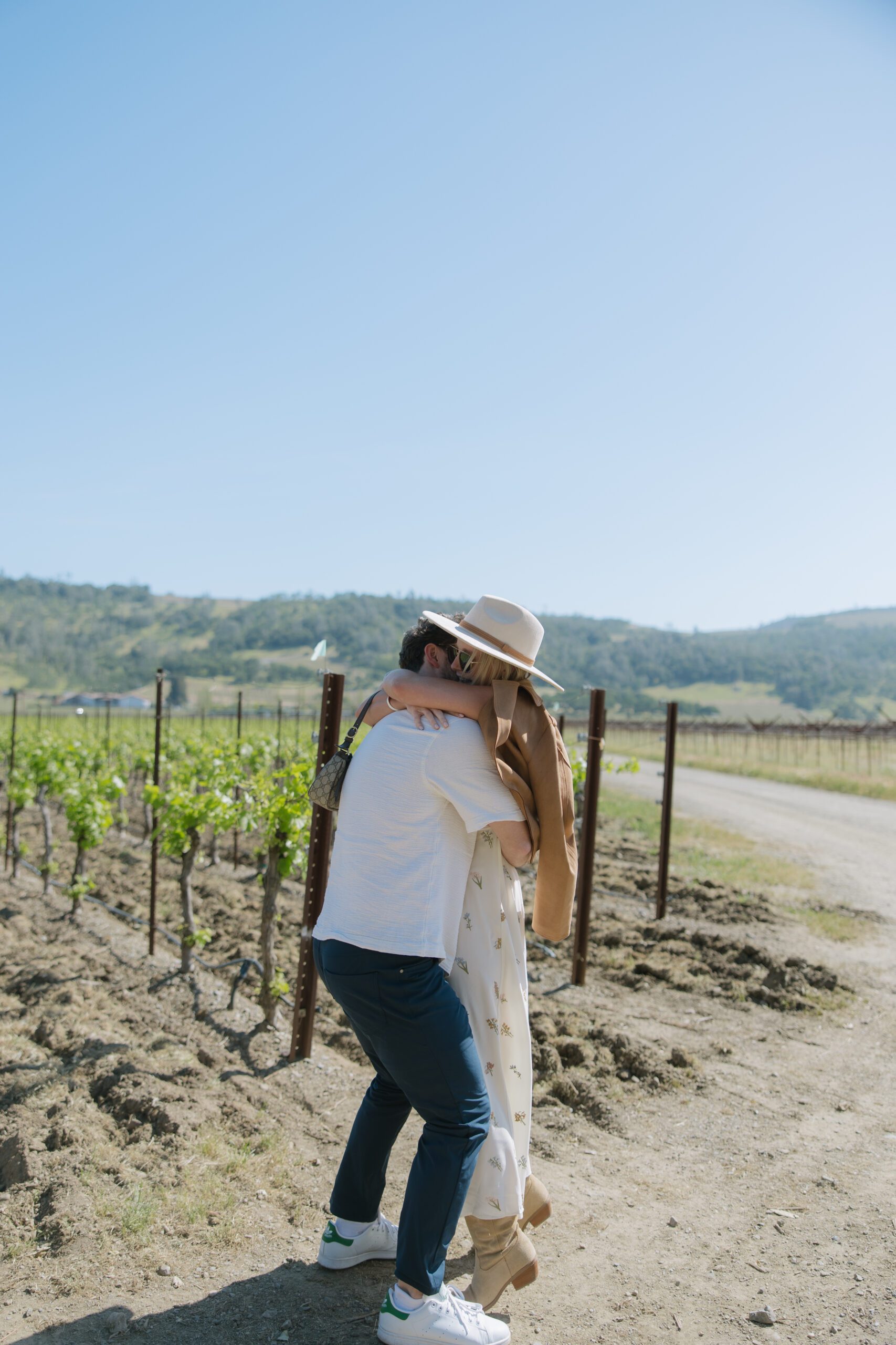 A couple hugging after a surprise proposal