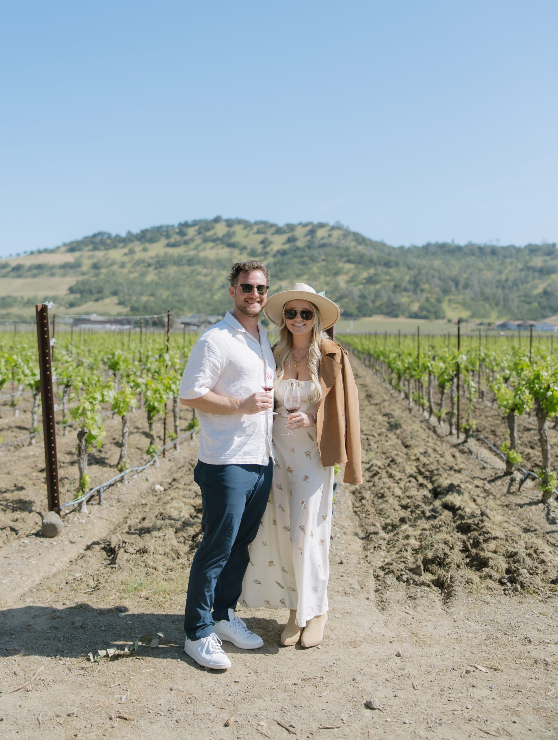 A couple posing for photos before their surprise proposal, as a romantic proposal idea