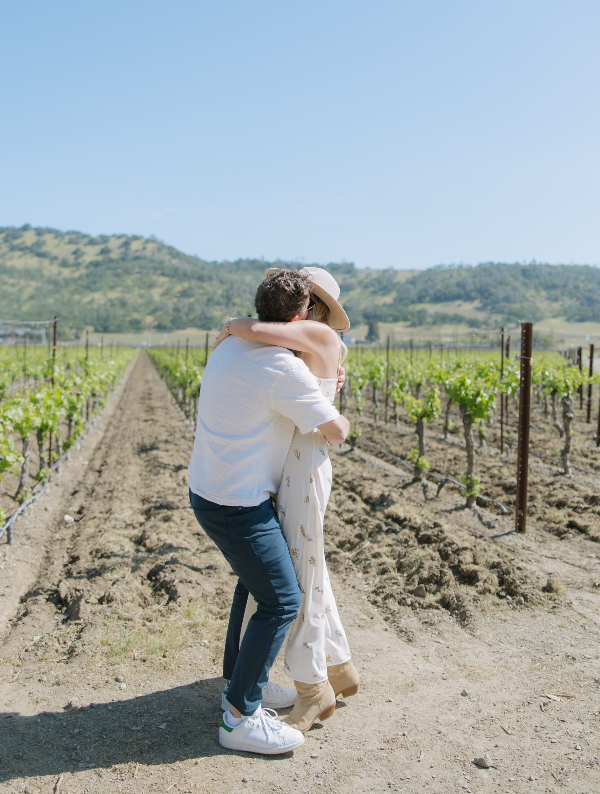 A couple hugging after getting engaged