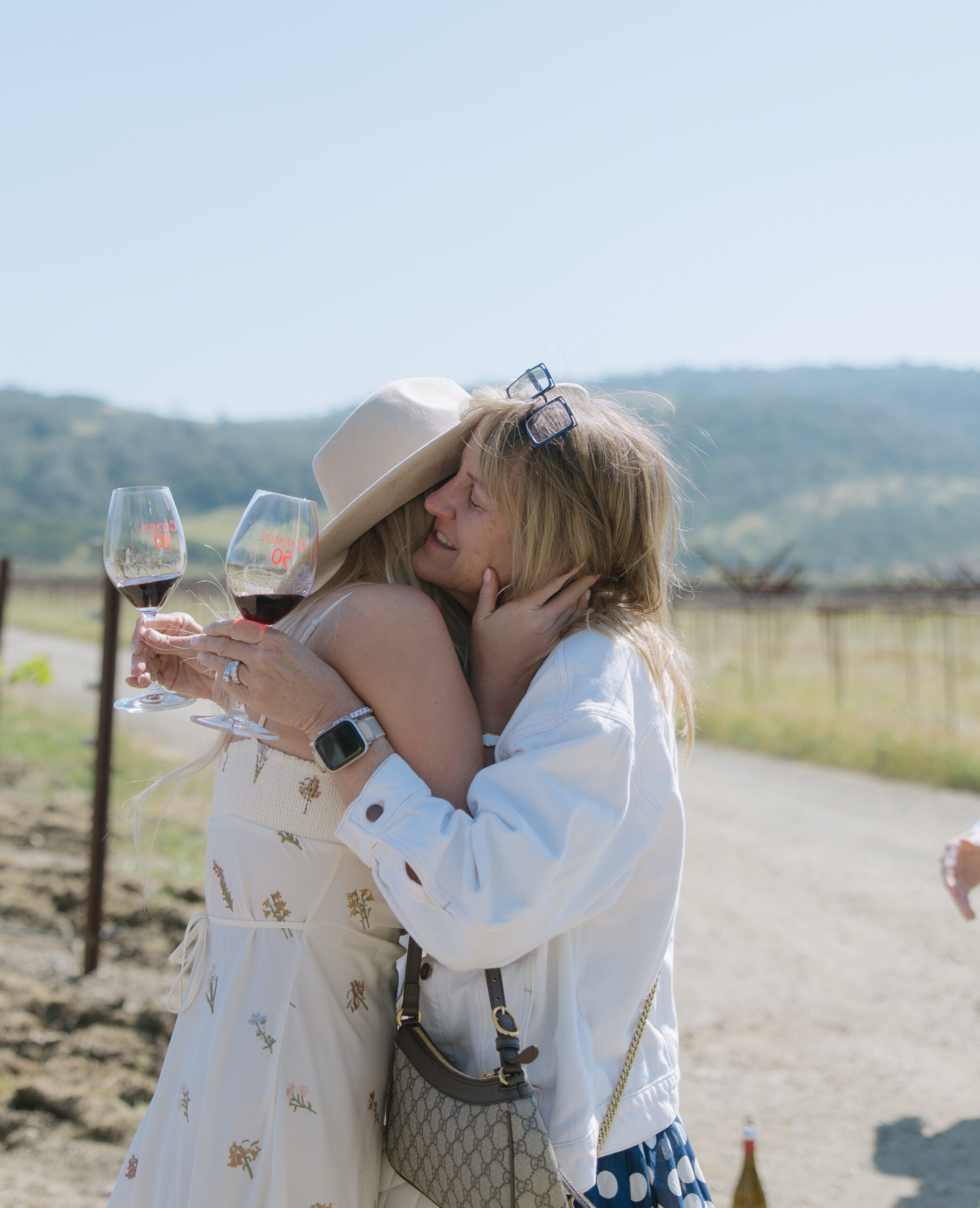 A woman hugging her mom after getting engaged