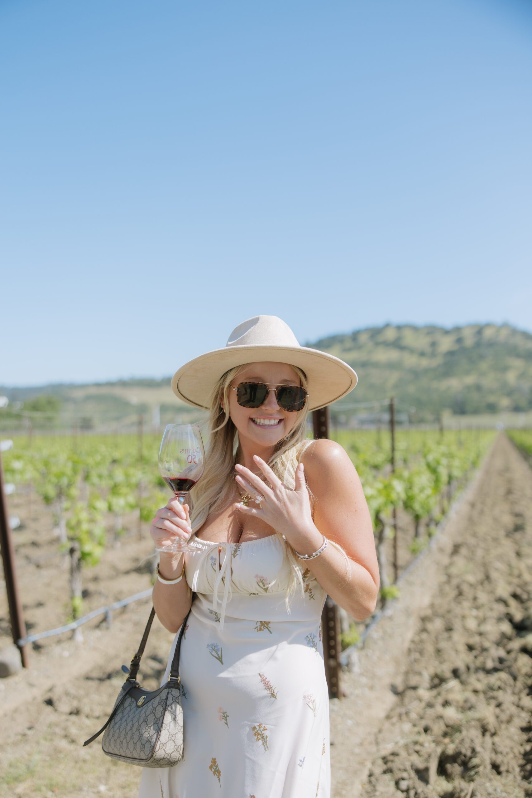 A woman showing off her engagement ring after her surprise proposal