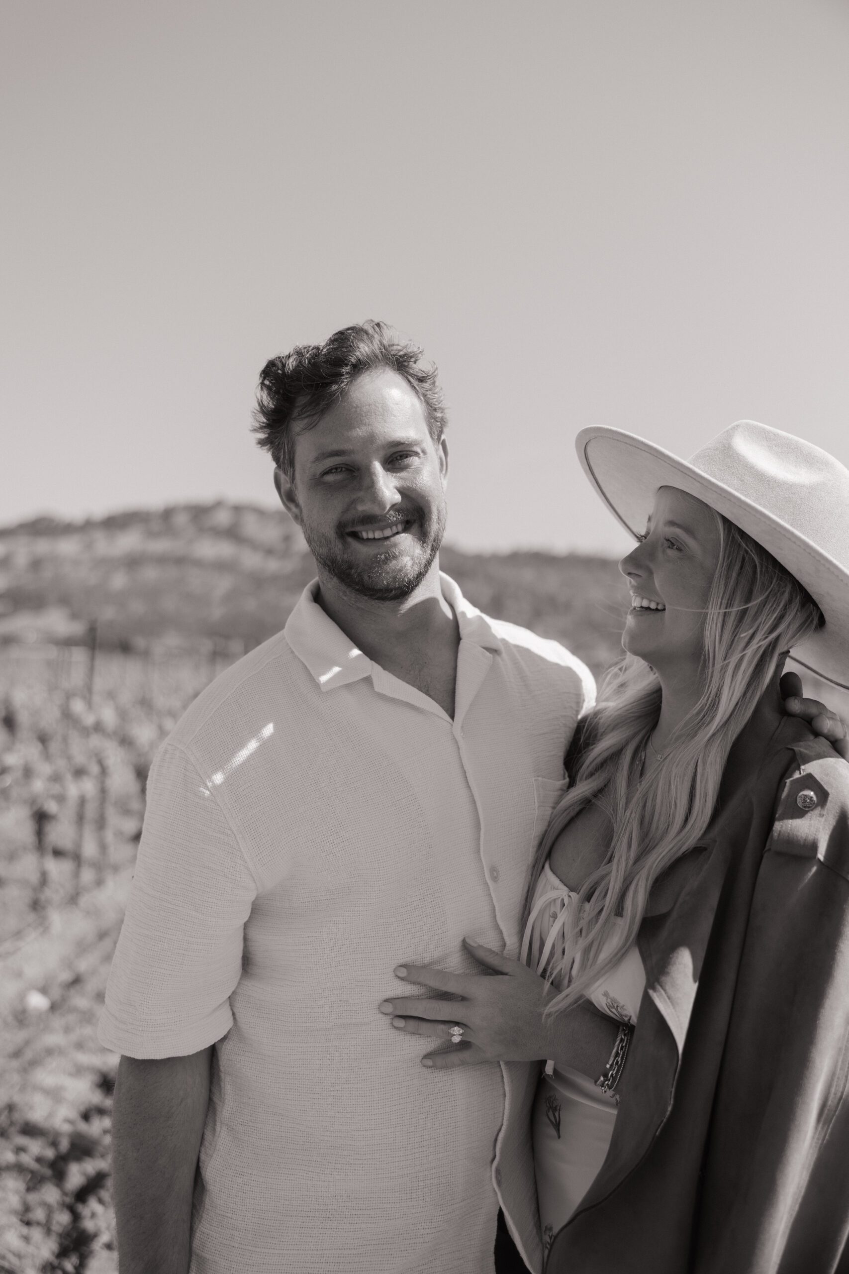 A couple taking vineyard engagement photos in Napa Valley