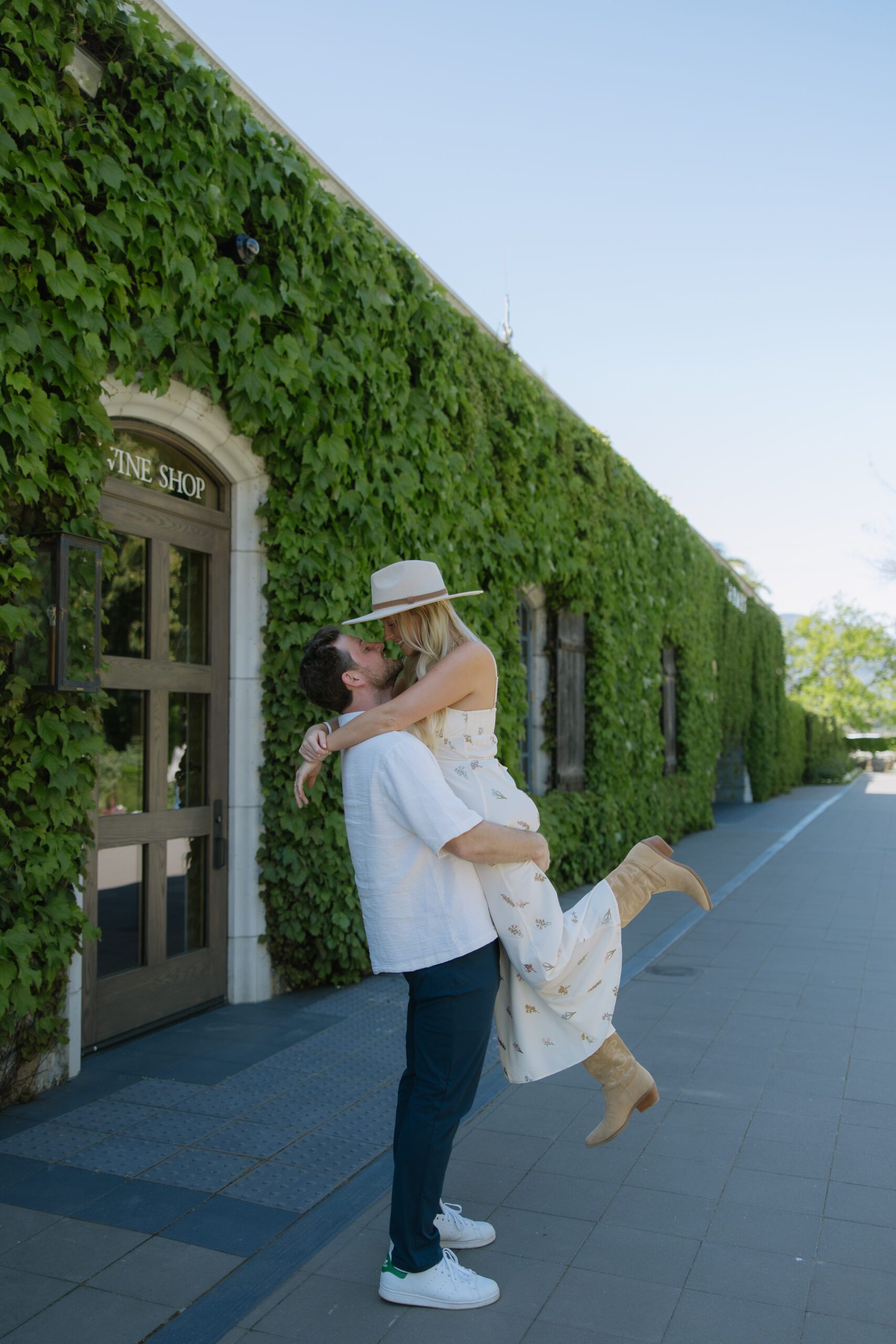 A couple taking vineyard engagement photos in Napa Valley