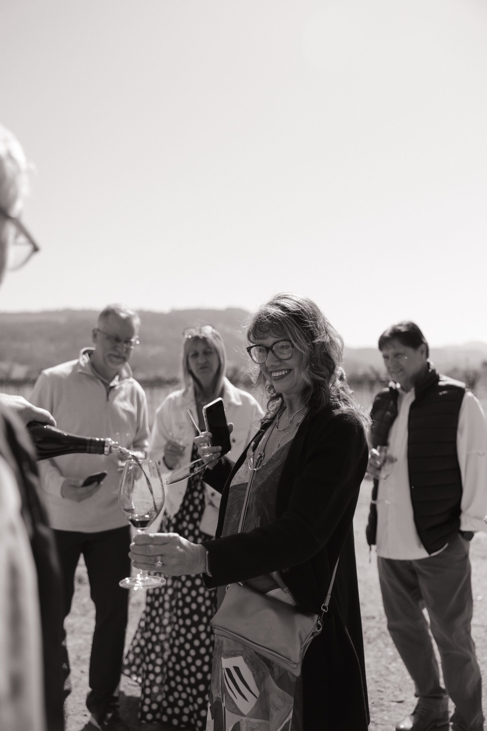 A family at a vineyard before a surprise proposal, as a romantic proposal idea