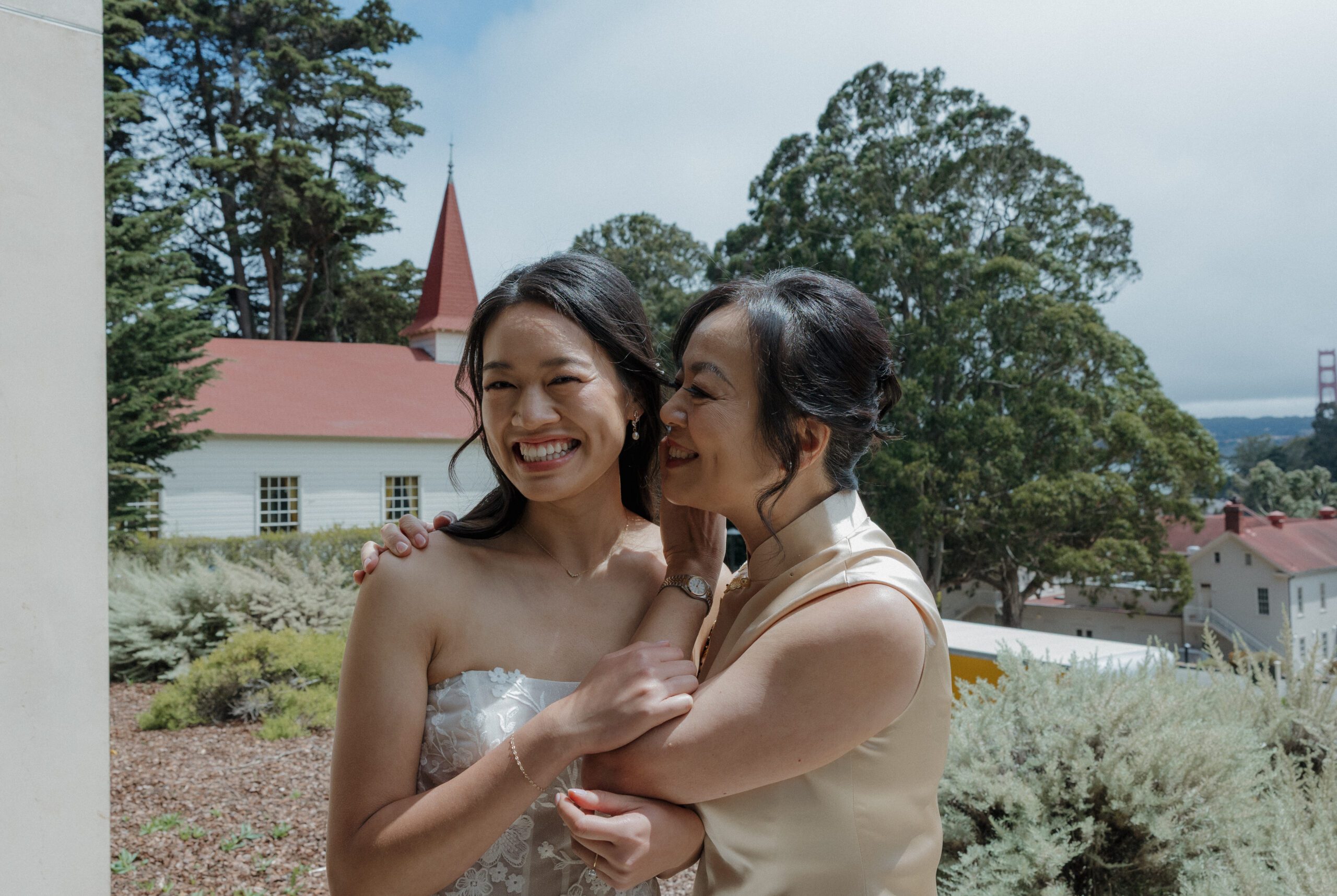 A candid photo of a bride and mother of the bride