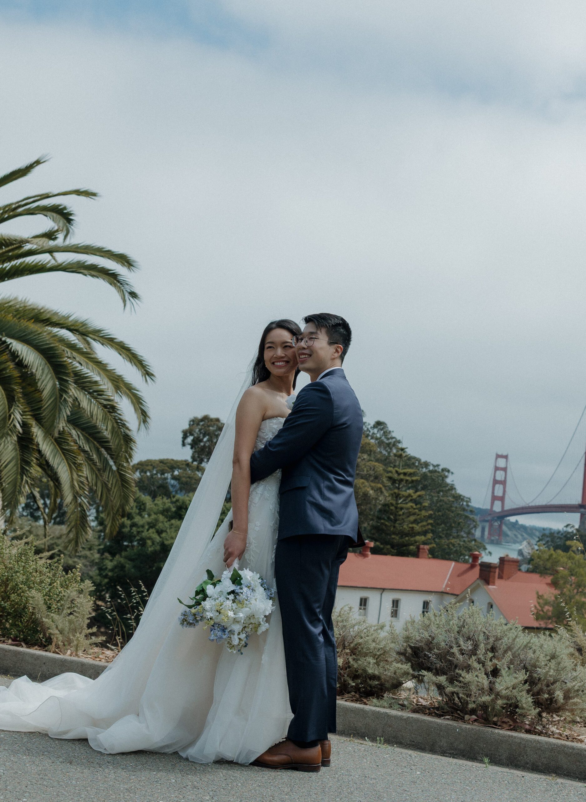 A bride and groom posing for wedding photos at Cavallo Point Lodge