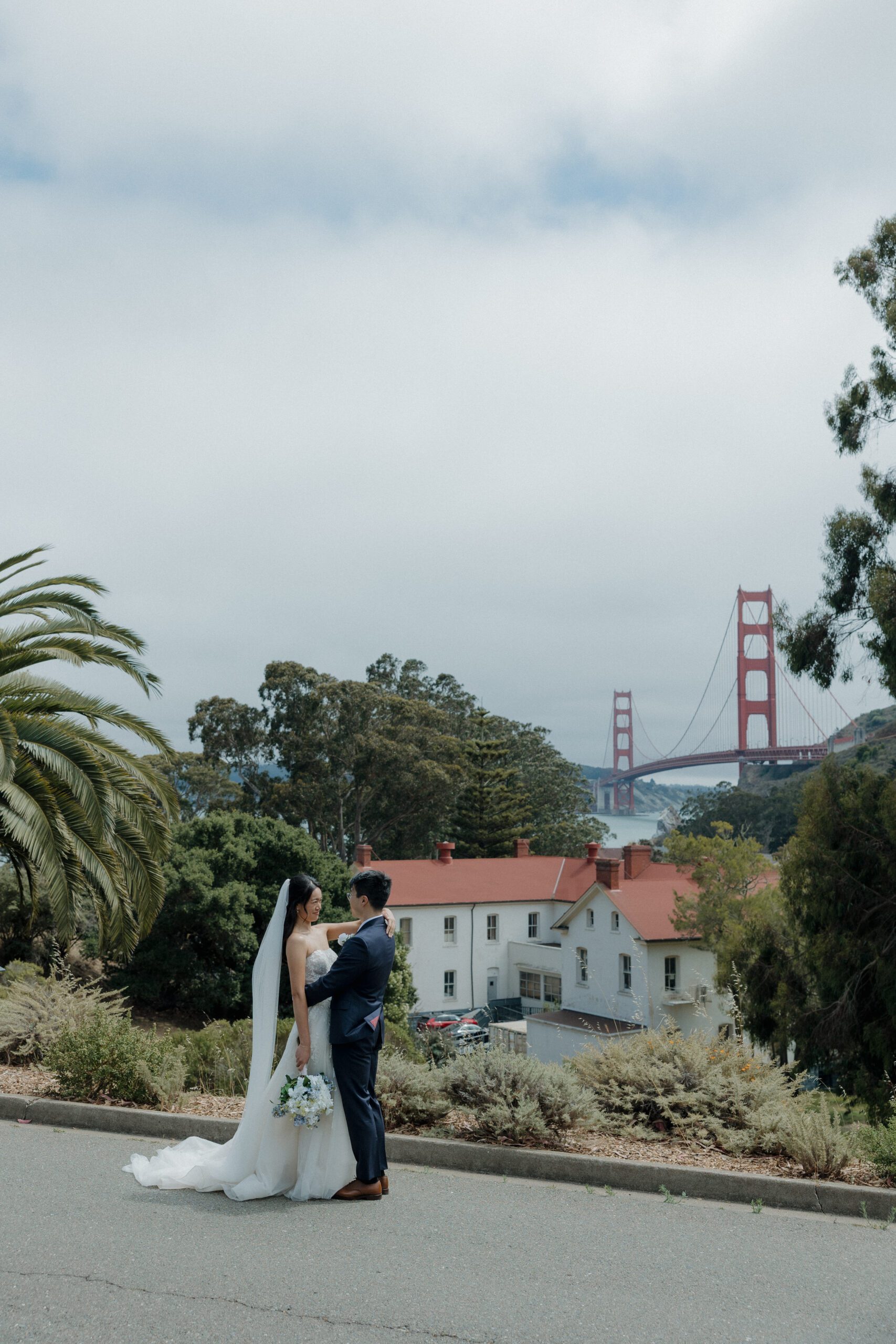 A bride and groom posing for wedding photos at Cavallo Point Lodge