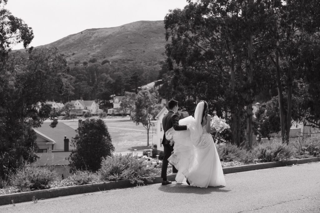 A bride and groom walking through Cavallo Point Lodge, their San Francisco wedding venue
