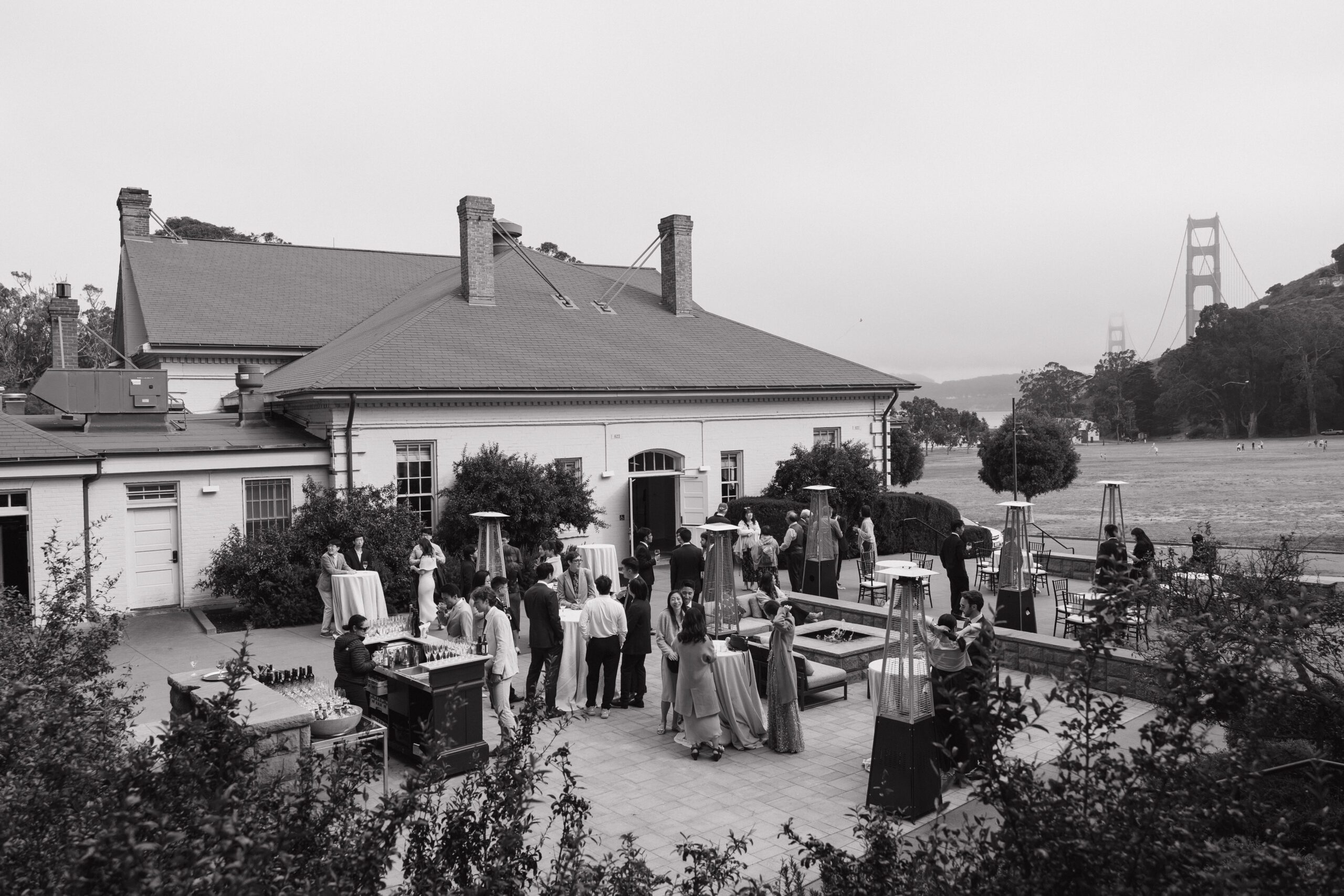 A cocktail hour in a black and white wedding photo