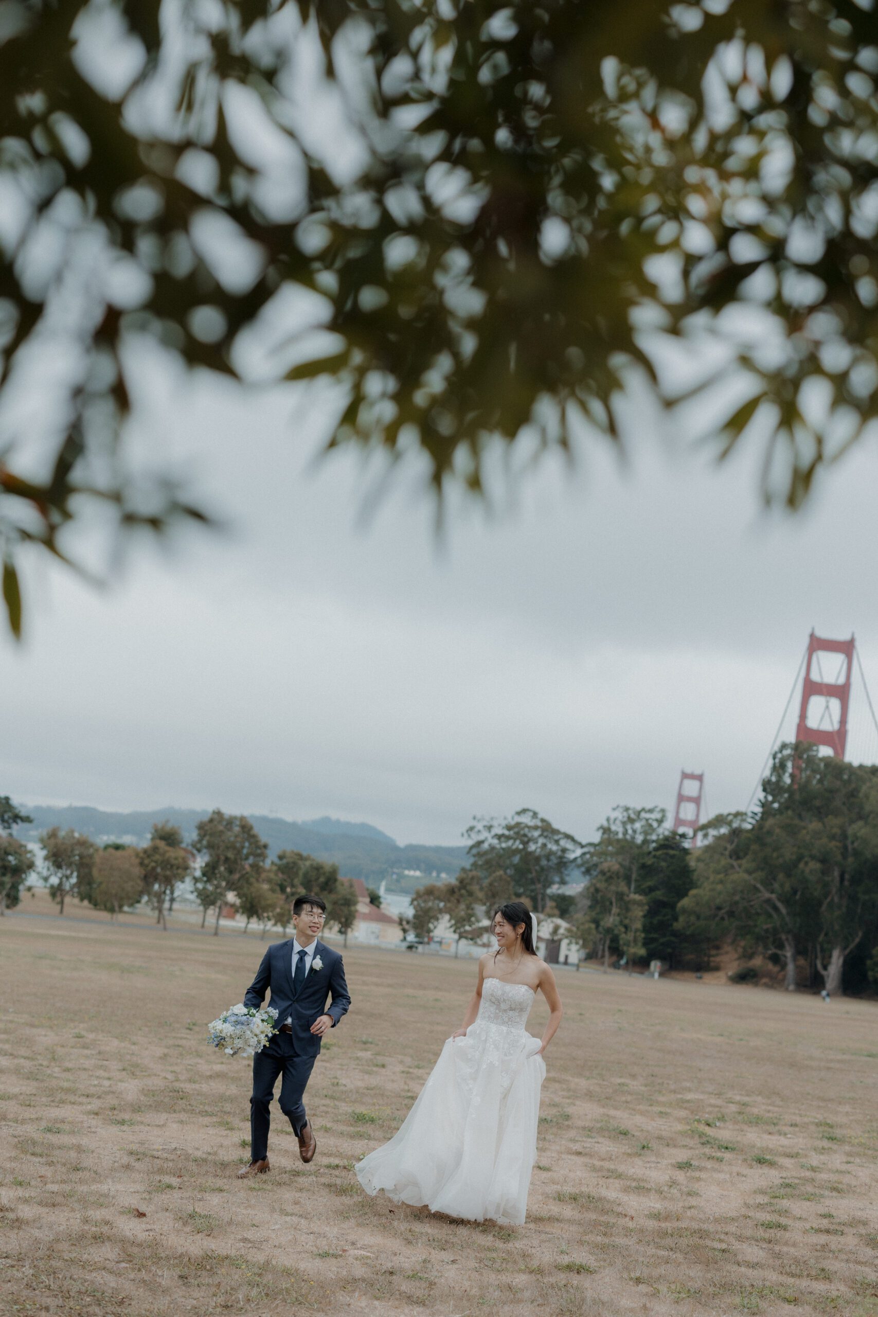 A bride and groom in a field for Cavallo Point Lodge wedding photos