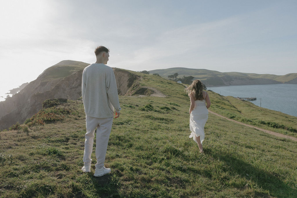 A couple taking engagmenet phoots at Point Reyes