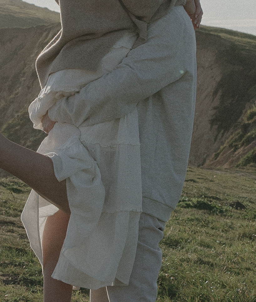A man holding his fiancee during engagement photos at Point Reyes