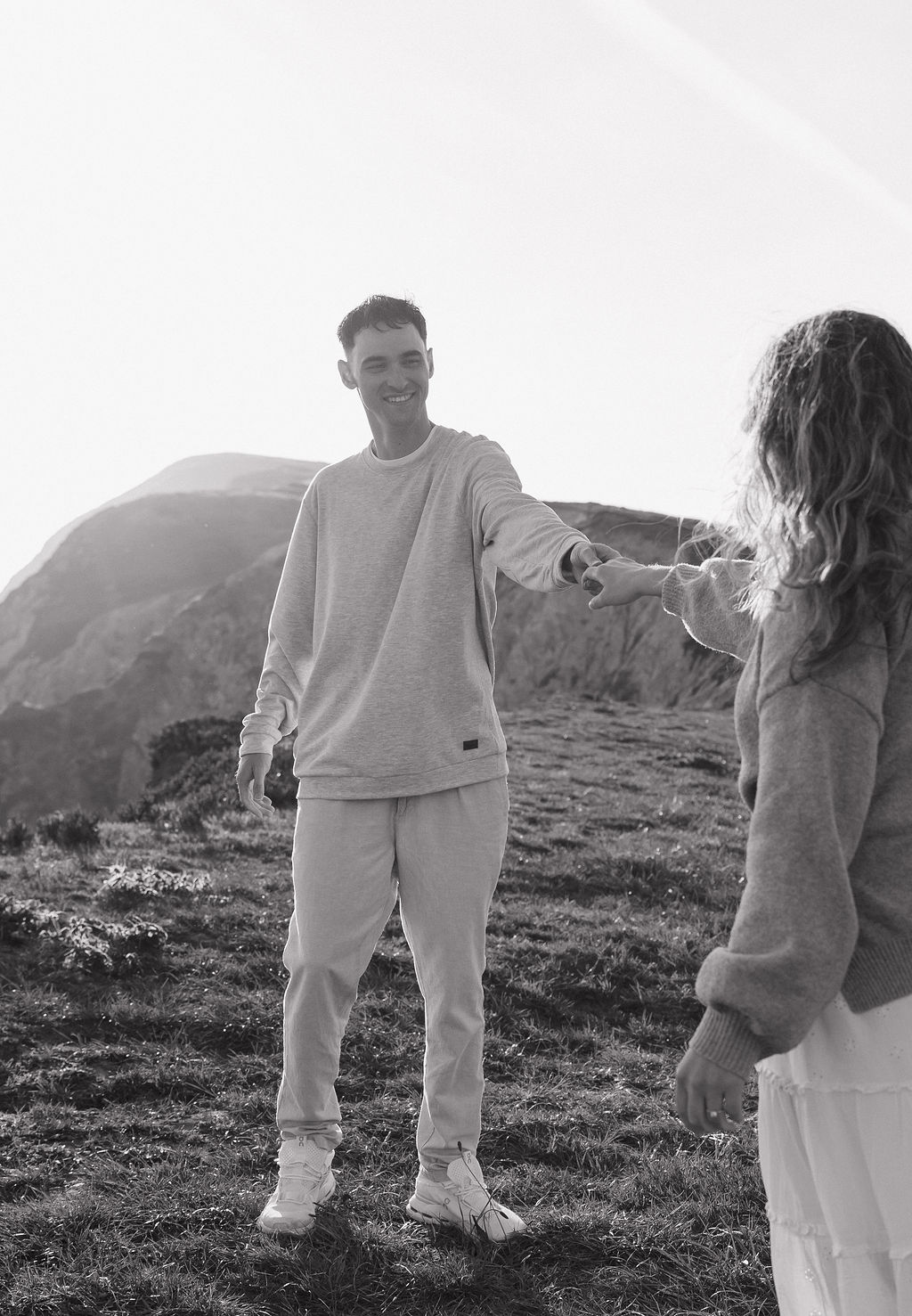 A couple dancing during their outdoor engagement photoshoot