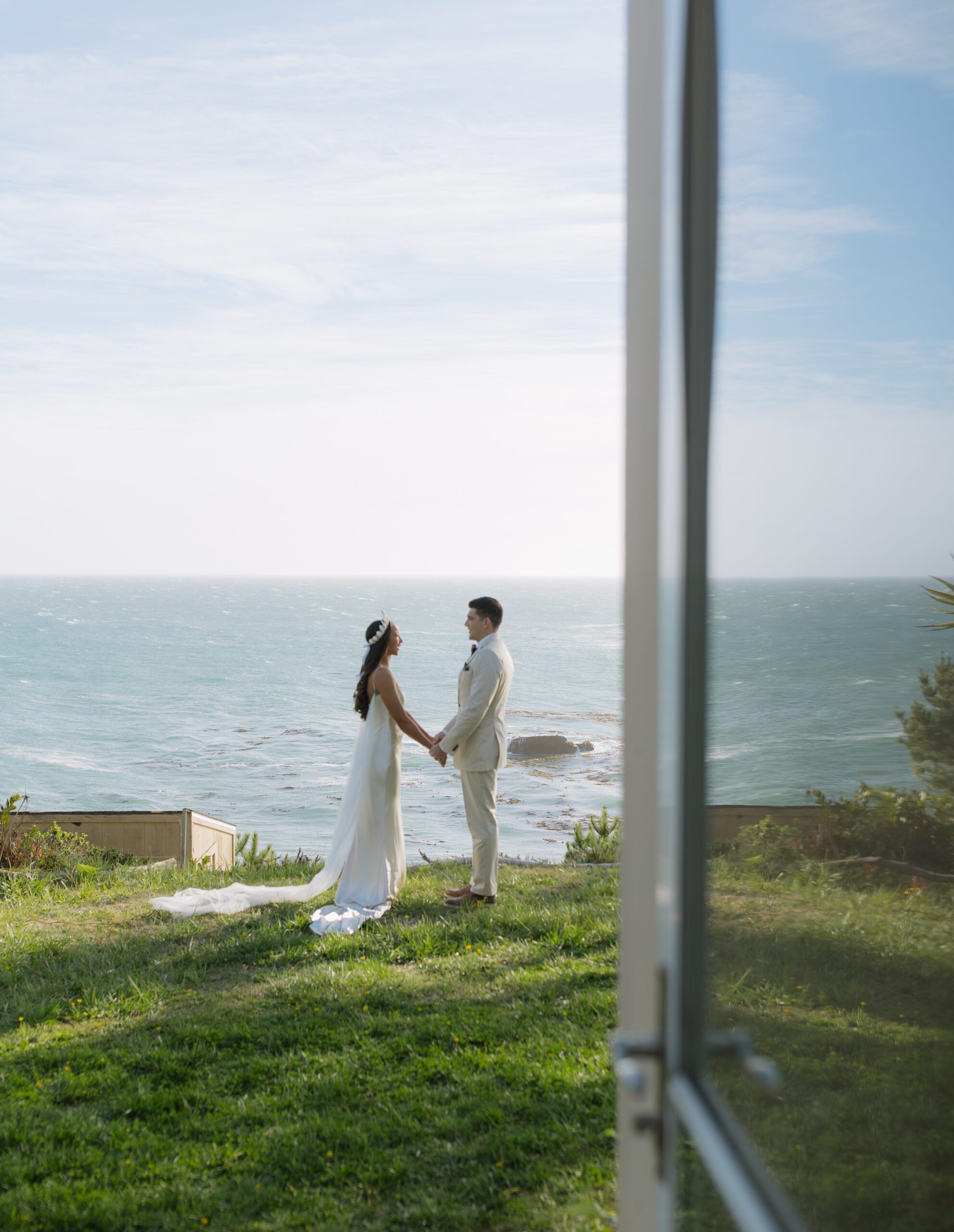 A bride and groom reading private vows during their Bodega Bay wedding