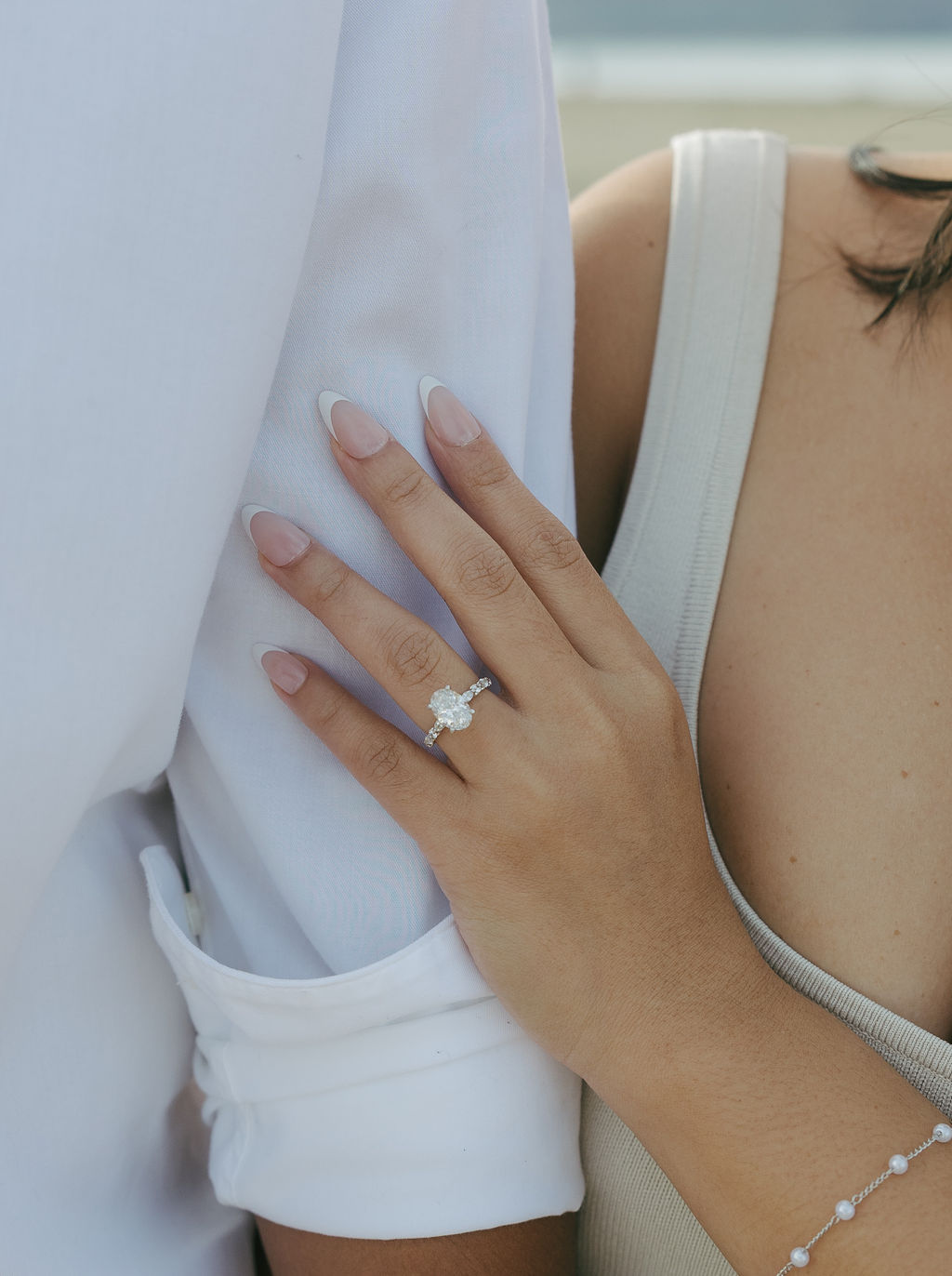 A couple's casual beach engagement outfits