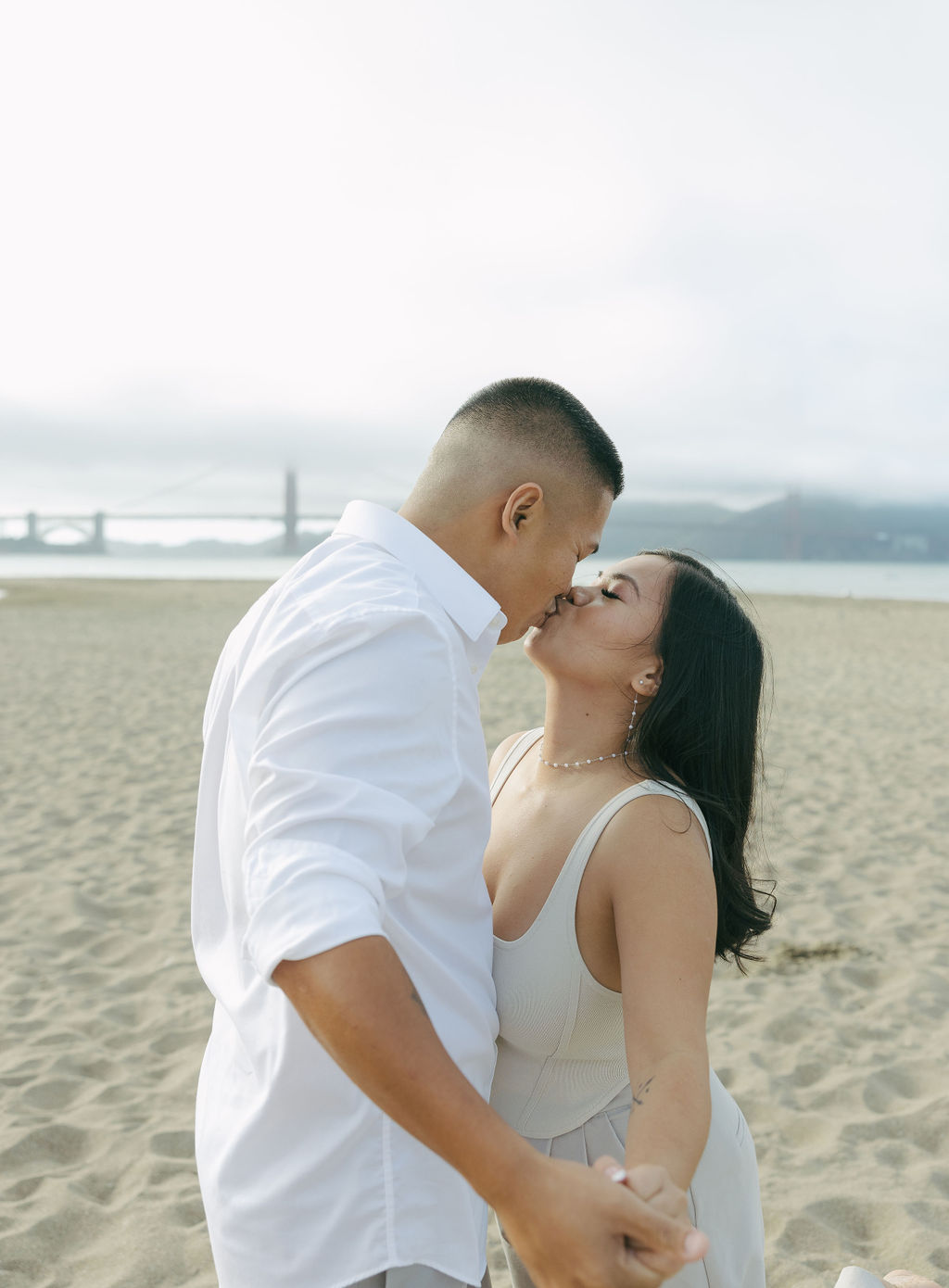 A couple kissing on the beach