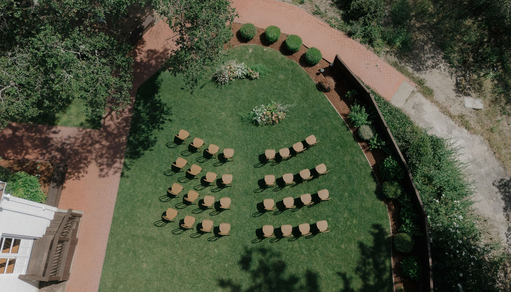 An aerial view of an intimate wedding ceremony setup
