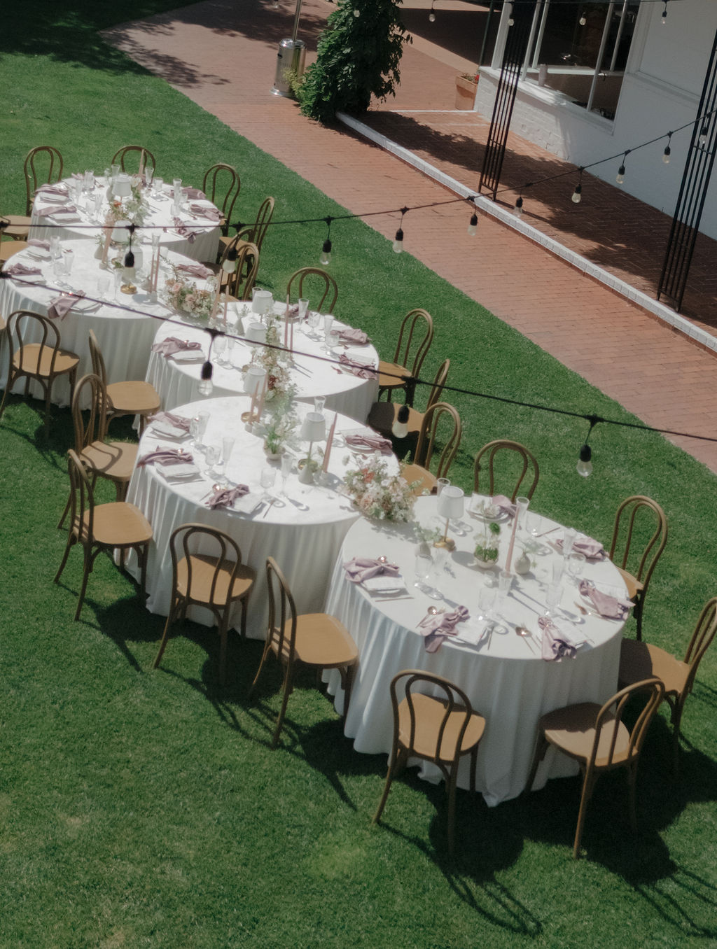 An aerial view of wedding reception tables on the lawn at hollins house