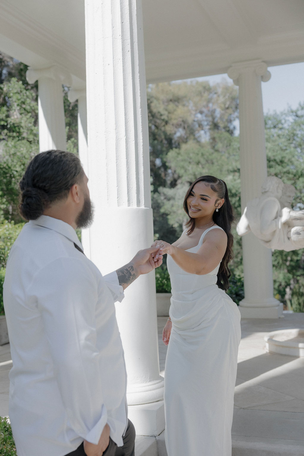 A groom holding his wife's hand at their Montalvo Arts Center wedding