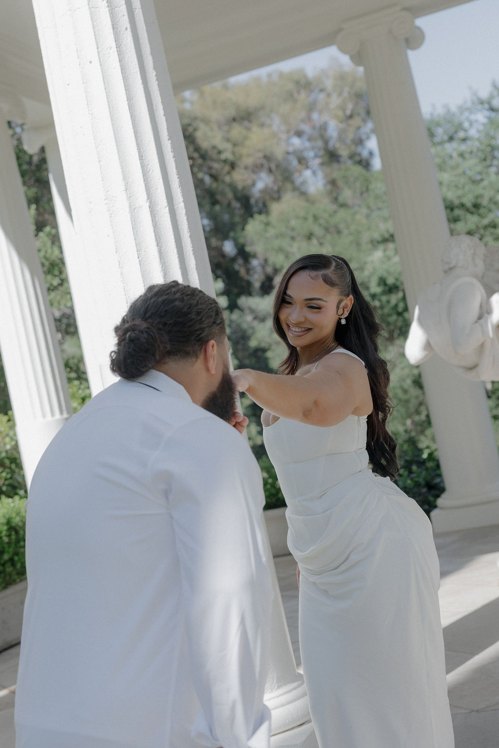 A groom kissing his wife's hand at their Montalvo Arts Center wedding