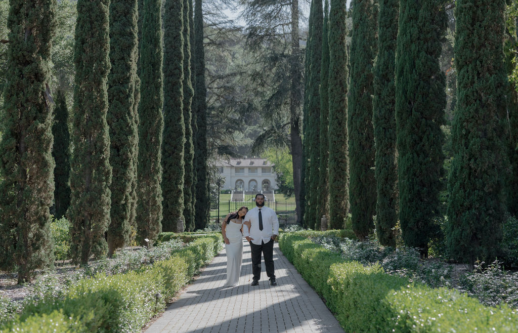 A bride and groom posing for garden wedding photos at their Montalvo Arts Center wedding