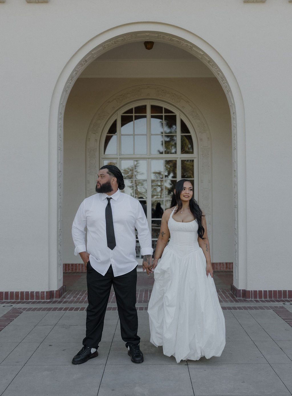 A bride and groom taking wedding photos at their Montalvo Arts Center wedding