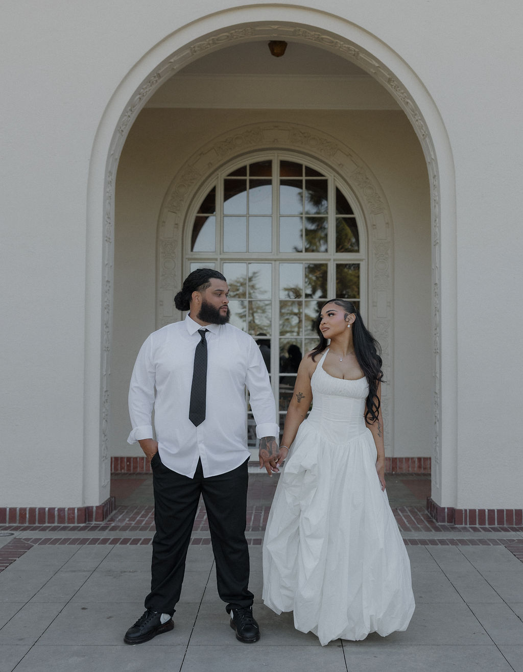 A bride and groom taking wedding photos at their Montalvo Arts Center wedding