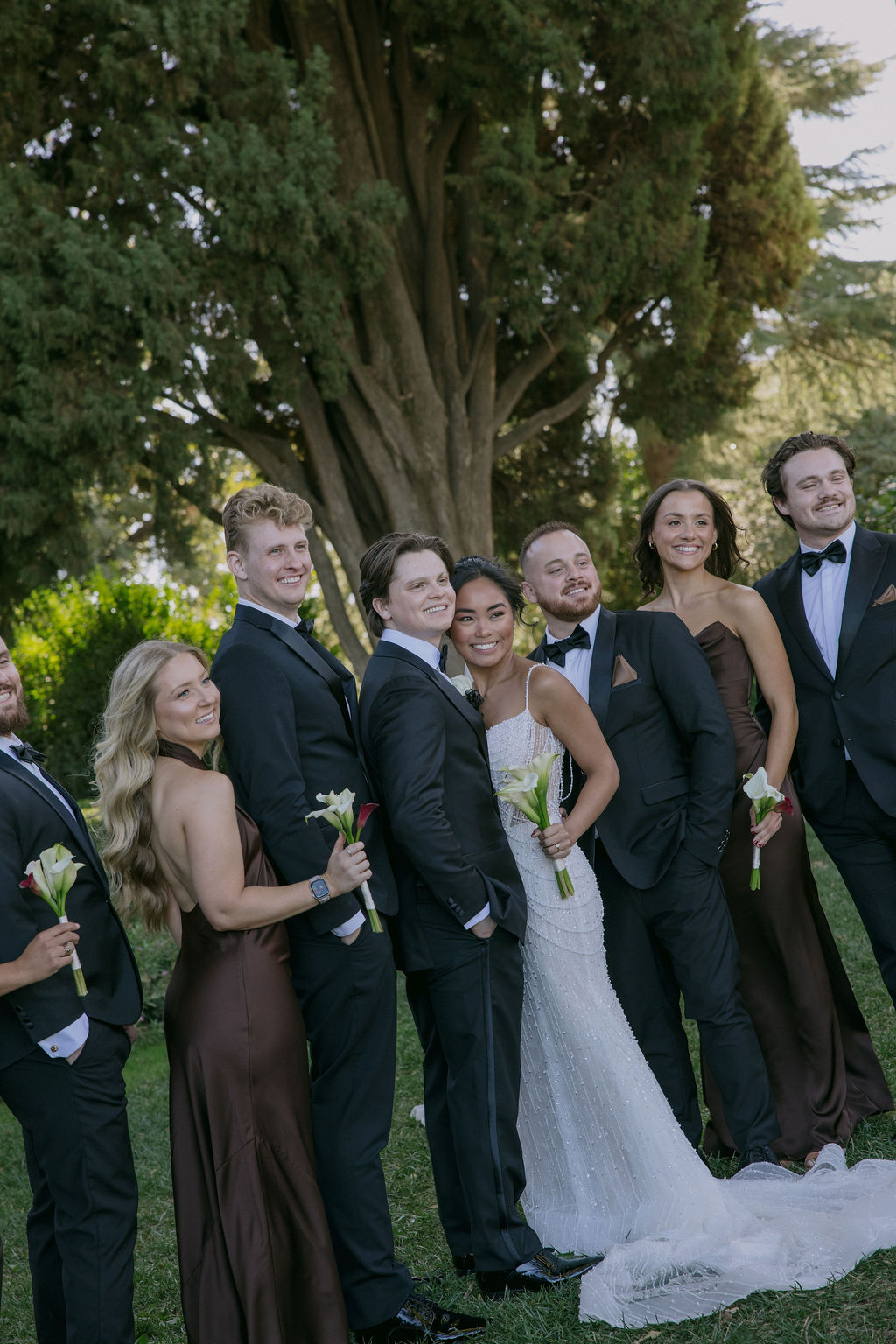A wedding party posing for photos