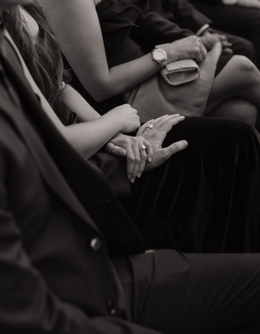 A black and white photo of guests a a wedding