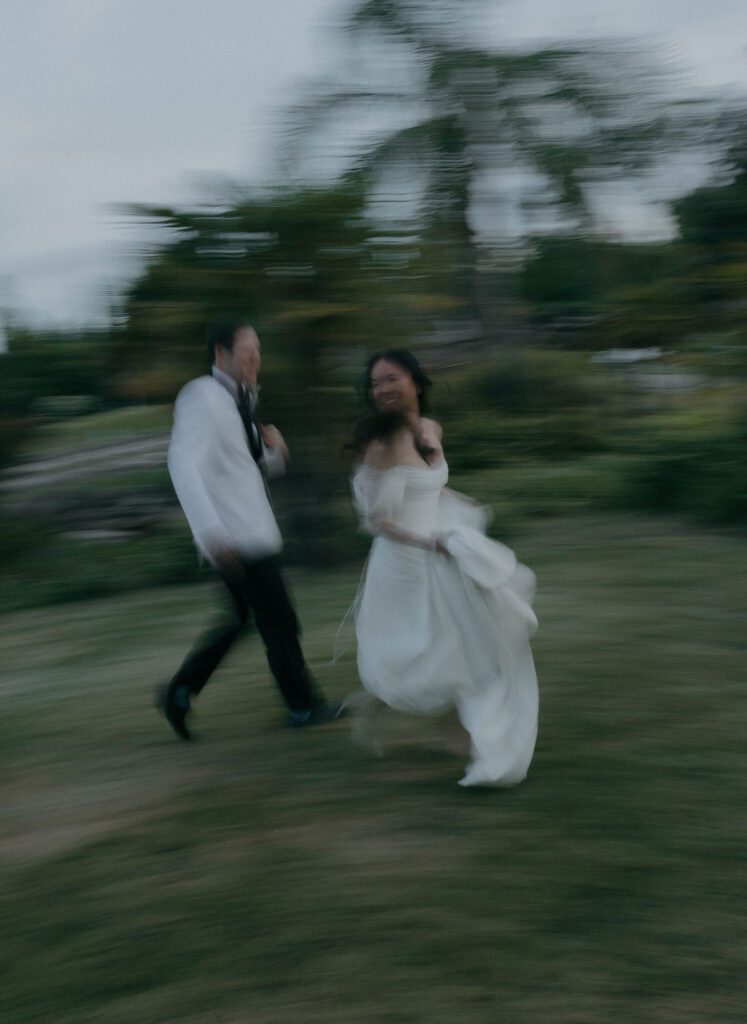 Blurry wedding photos of a couple running