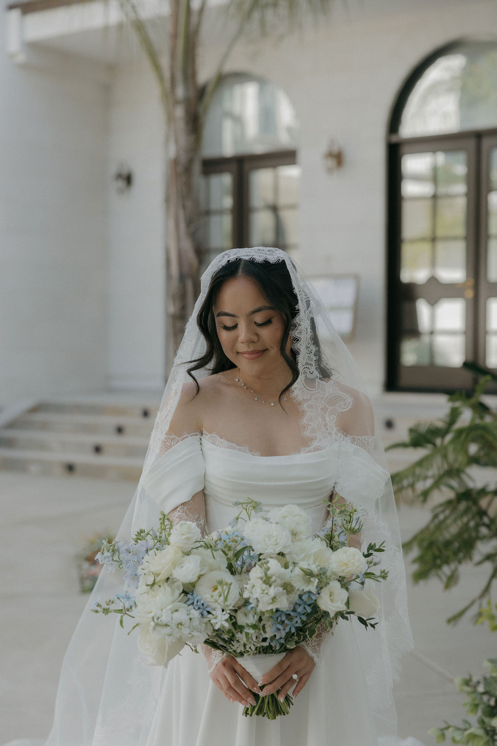 A bride posing for photos at white swan castle