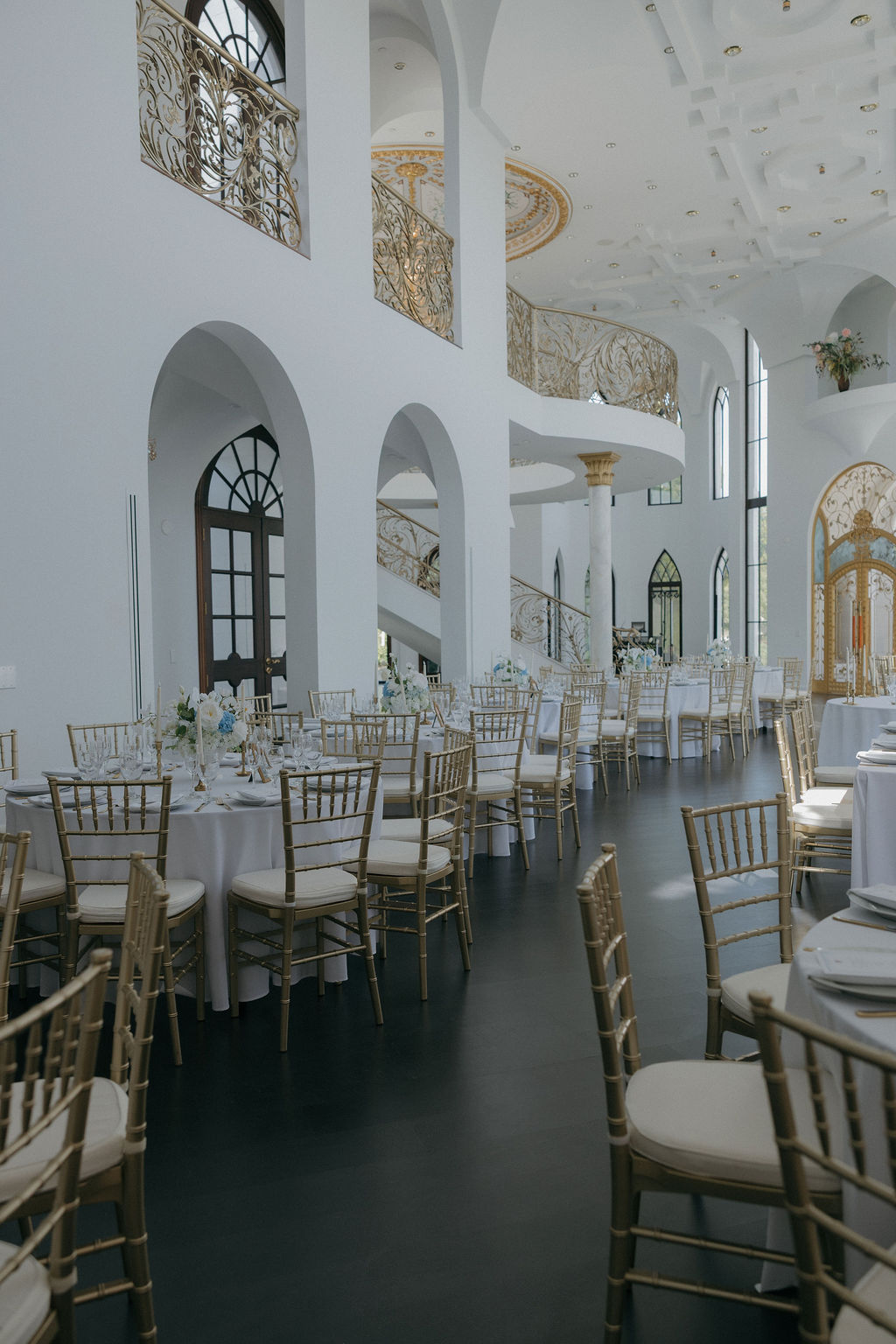 A wedding reception setup inside of a castle wedding venue