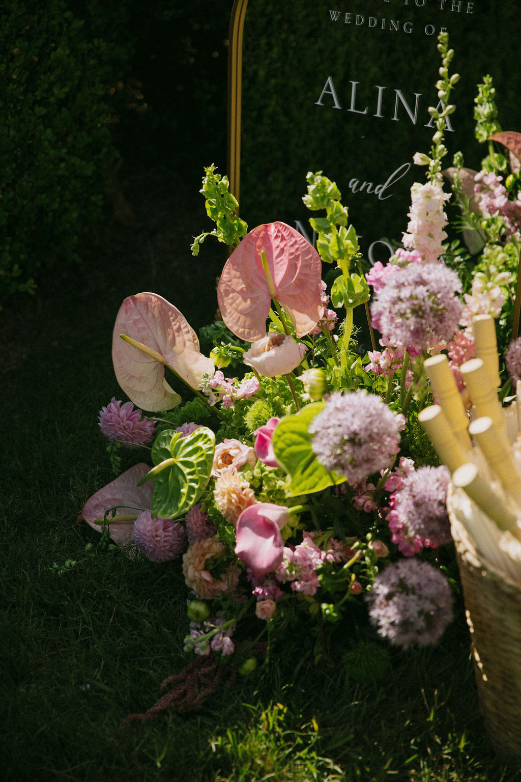 Pink and green wedding ceremony flowers