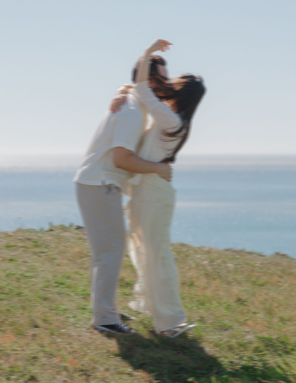 Blurry engagement photos on the coast