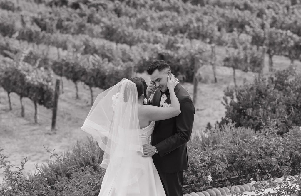 a bride and groom during their first look