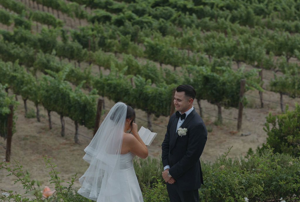 A bride and groom during private vows at CordeValle Winery