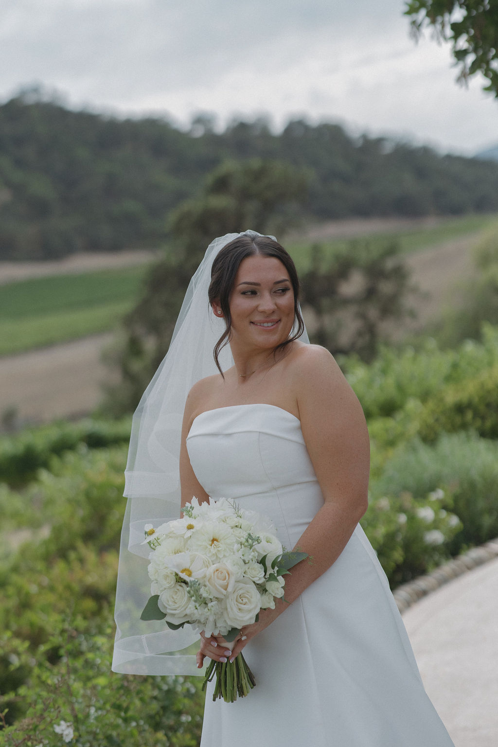 a bride taking wedding photos at Cordevalle winery