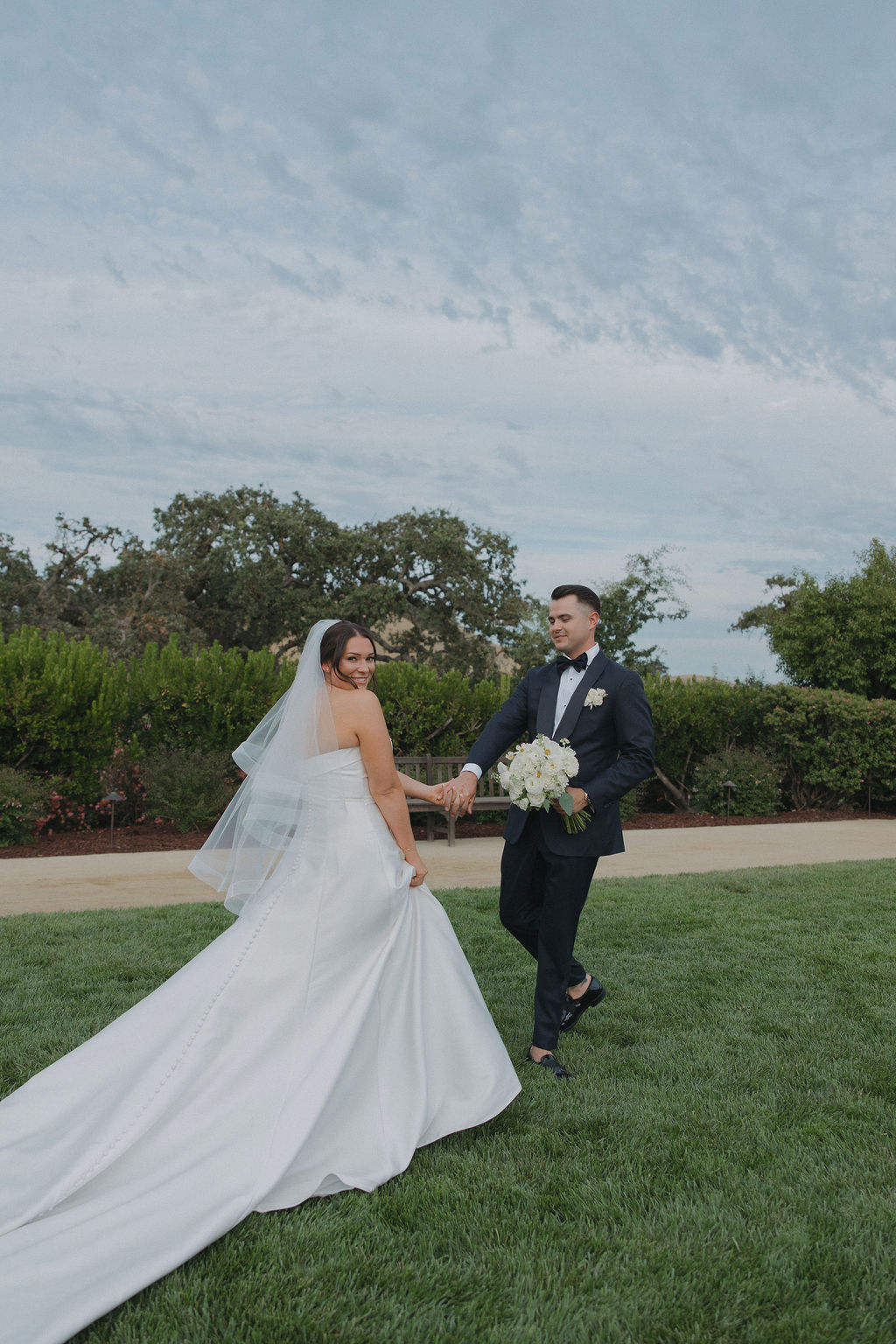 A bride and groom taking wedding photos
